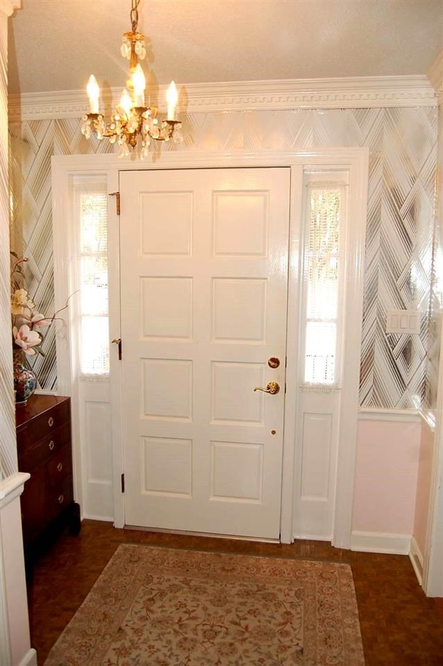 800 Purdue Street Raleigh, NC 27609 - Photo 3 of 21 a view of a livingroom with wooden floor and a chandelier