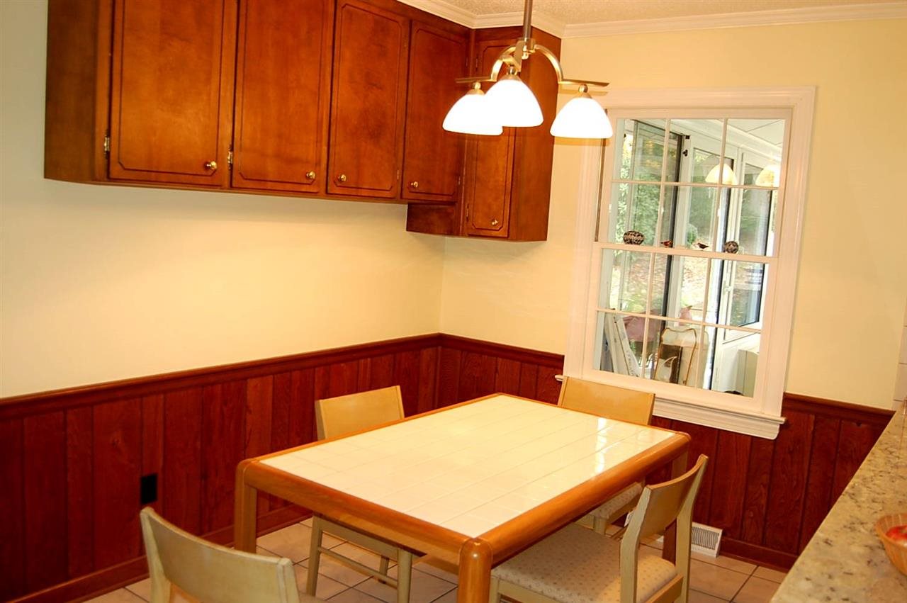 800 Purdue Street Raleigh, NC 27609 - Photo 7 of 21 a view of a dining room with a table and chairs