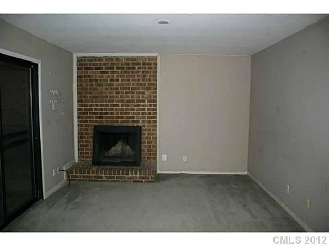 11051 Cedar View Road Charlotte, NC 28226 - Photo 5 of 9 a living room with a fireplace