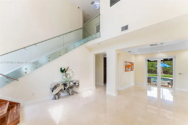 a view of entryway and hall with a front door