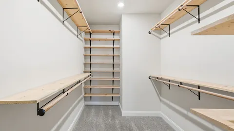 a view of an empty walk in closet