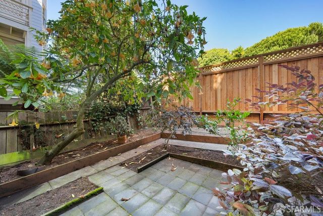 a view of houses with a street