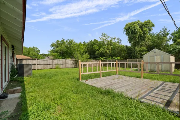 a view of a backyard with a garden and plants