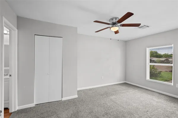 a view of an empty room with a window