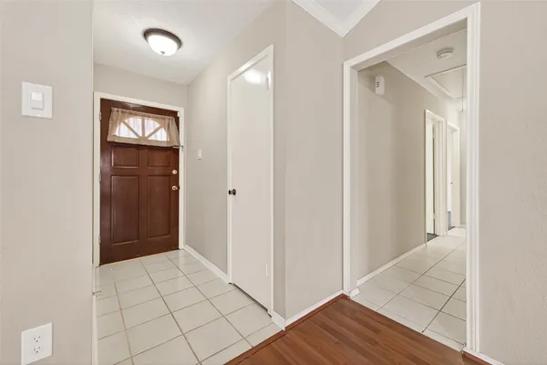 a view of an empty room and wooden floor