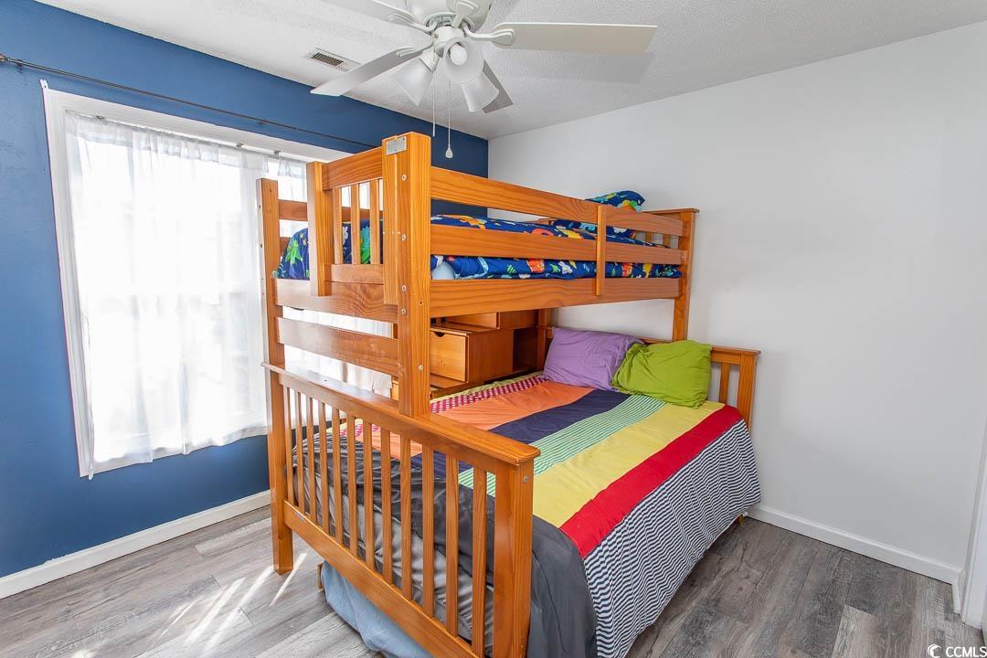 761 Drawbridge Drive Conway, SC 29526 - Photo 20 of 36 Bedroom with a ceiling fan and wood finished floors