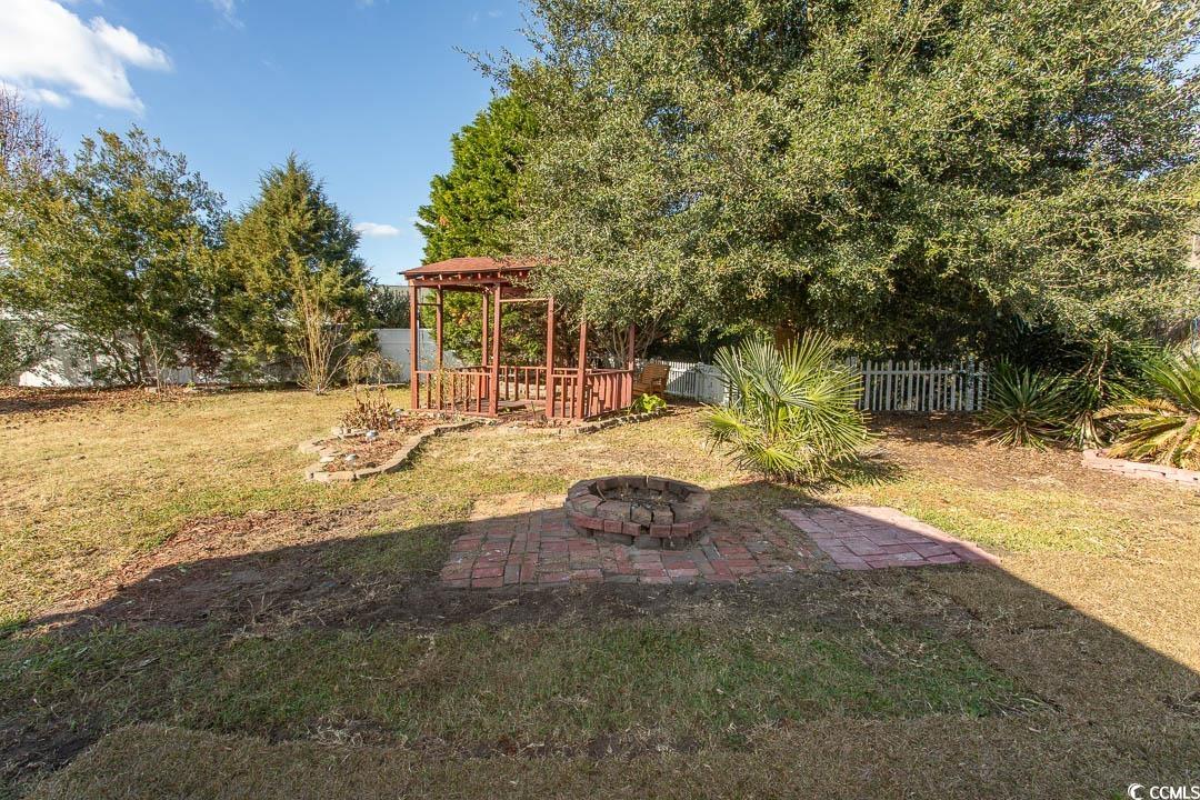 761 Drawbridge Drive Conway, SC 29526 - Photo 25 of 36 Fenced backyard featuring a patio and a fire pit