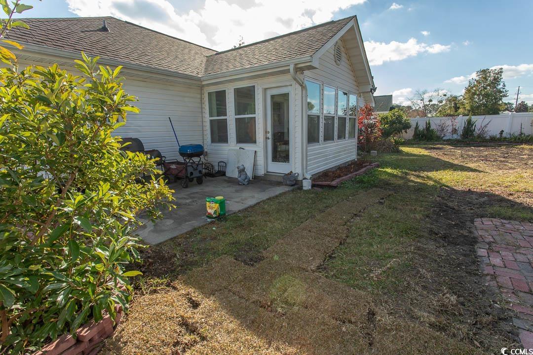 761 Drawbridge Drive Conway, SC 29526 - Photo 26 of 36 Rear view of house featuring a patio area and roof with shingles