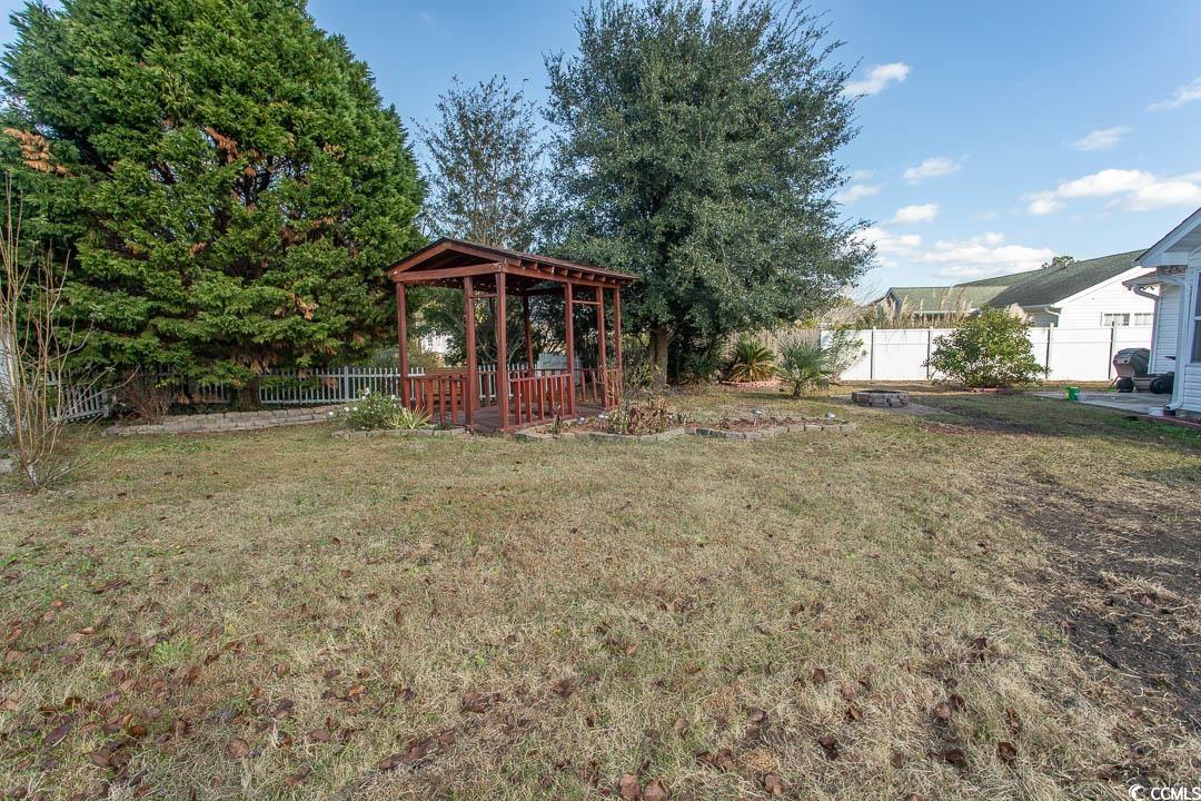 761 Drawbridge Drive Conway, SC 29526 - Photo 32 of 36 Fenced backyard with a gazebo