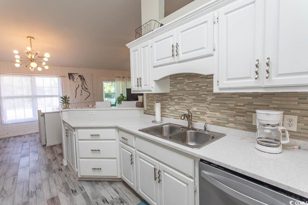 761 Drawbridge Drive Conway, SC 29526 - Photo 5 of 36 Kitchen with white cabinets, dishwasher, a chandelier, and light wood-type flooring