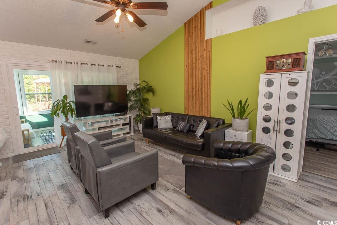 761 Drawbridge Drive Conway, SC 29526 - Photo 9 of 36 Living room featuring lofted ceiling, wood finished floors, and ceiling fan