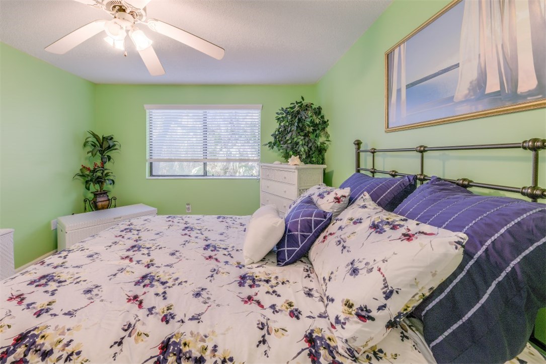 2743 Forest Ridge Drive, Unit I3 Fernandina Beach, FL 32034 - Photo 13 of 21 a bed sitting in a bedroom next to a window