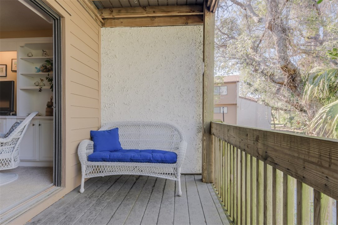 2743 Forest Ridge Drive, Unit I3 Fernandina Beach, FL 32034 - Photo 15 of 21 a view of a deck with wooden floor and bench