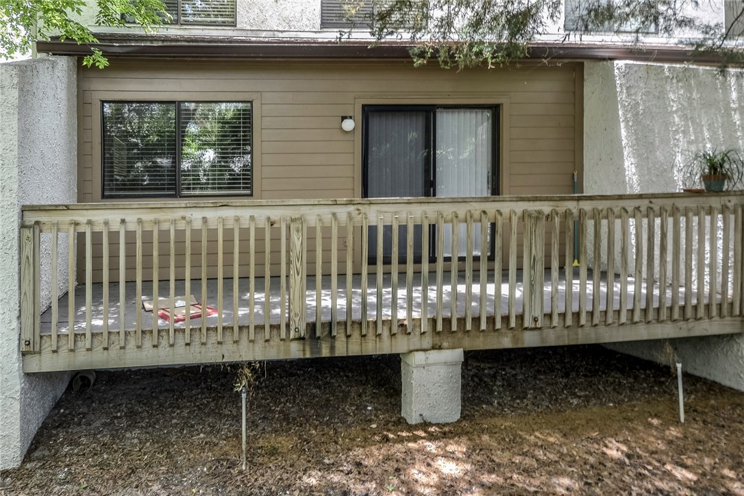 2743 Forest Ridge Drive, Unit I3 Fernandina Beach, FL 32034 - Photo 16 of 21 a table and chair in a porch