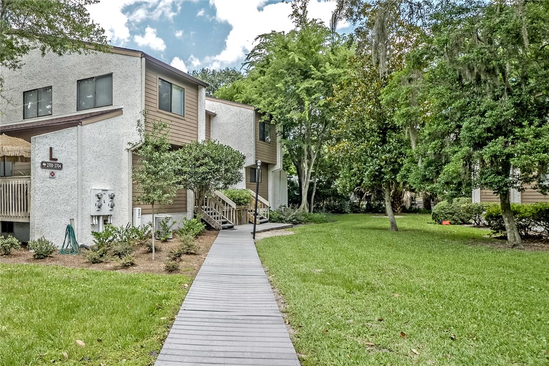2743 Forest Ridge Drive, Unit I3 Fernandina Beach, FL 32034 - Photo 19 of 21 a front view of a house with a yard