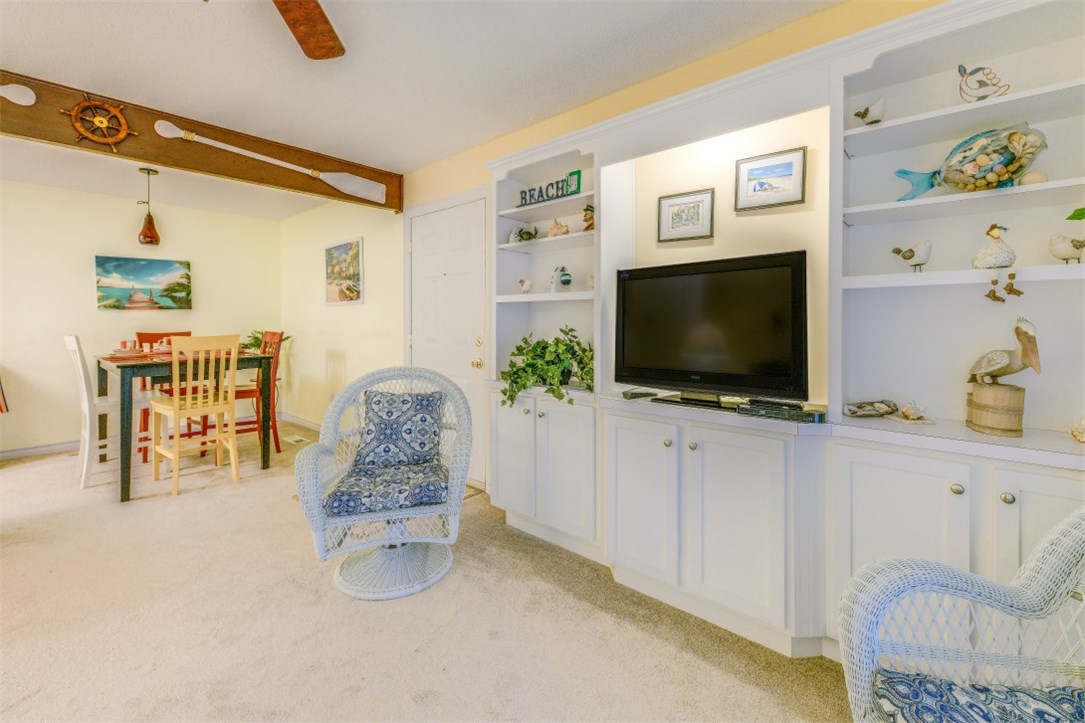 2743 Forest Ridge Drive, Unit I3 Fernandina Beach, FL 32034 - Photo 3 of 21 a living room with furniture and a flat screen tv