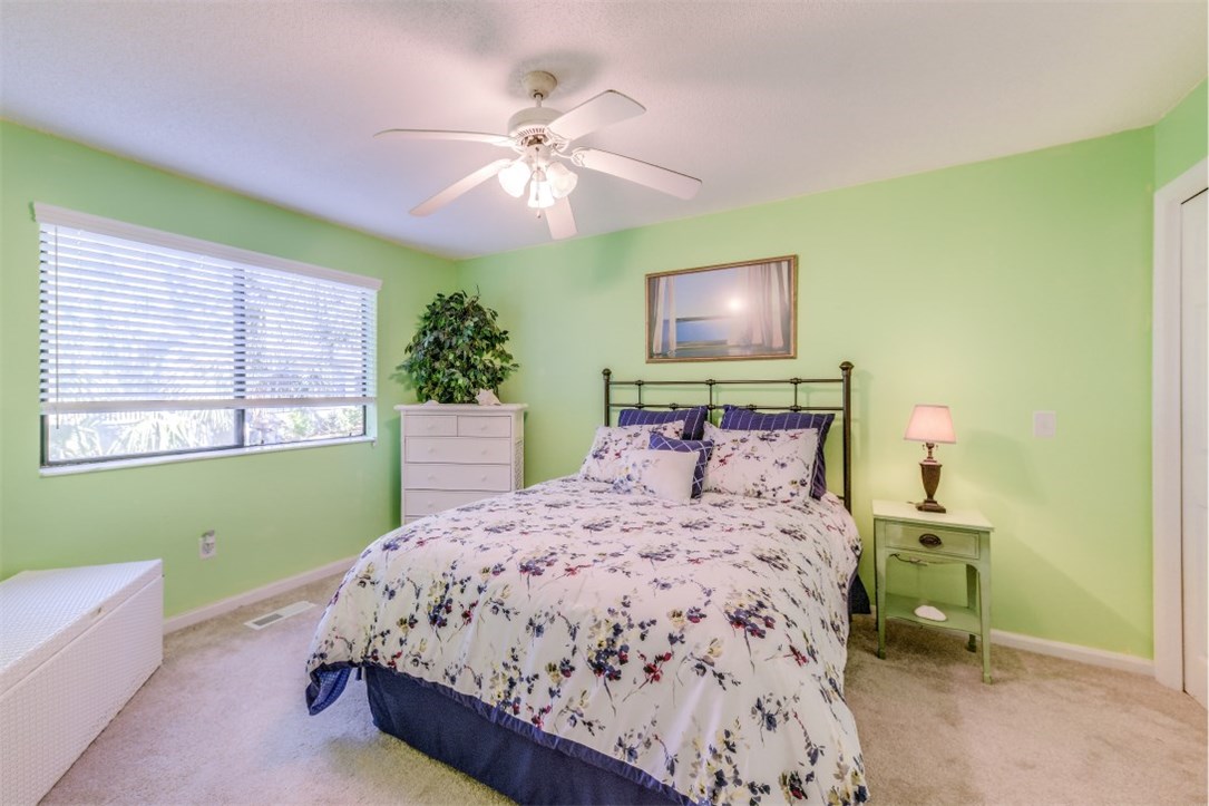 2743 Forest Ridge Drive, Unit I3 Fernandina Beach, FL 32034 - Photo 6 of 21 a bedroom with a bed and a window