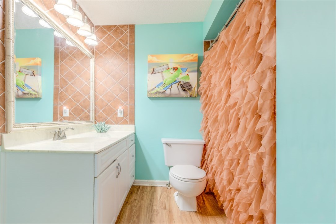 2743 Forest Ridge Drive, Unit I3 Fernandina Beach, FL 32034 - Photo 10 of 21 a bathroom with a toilet sink and mirror