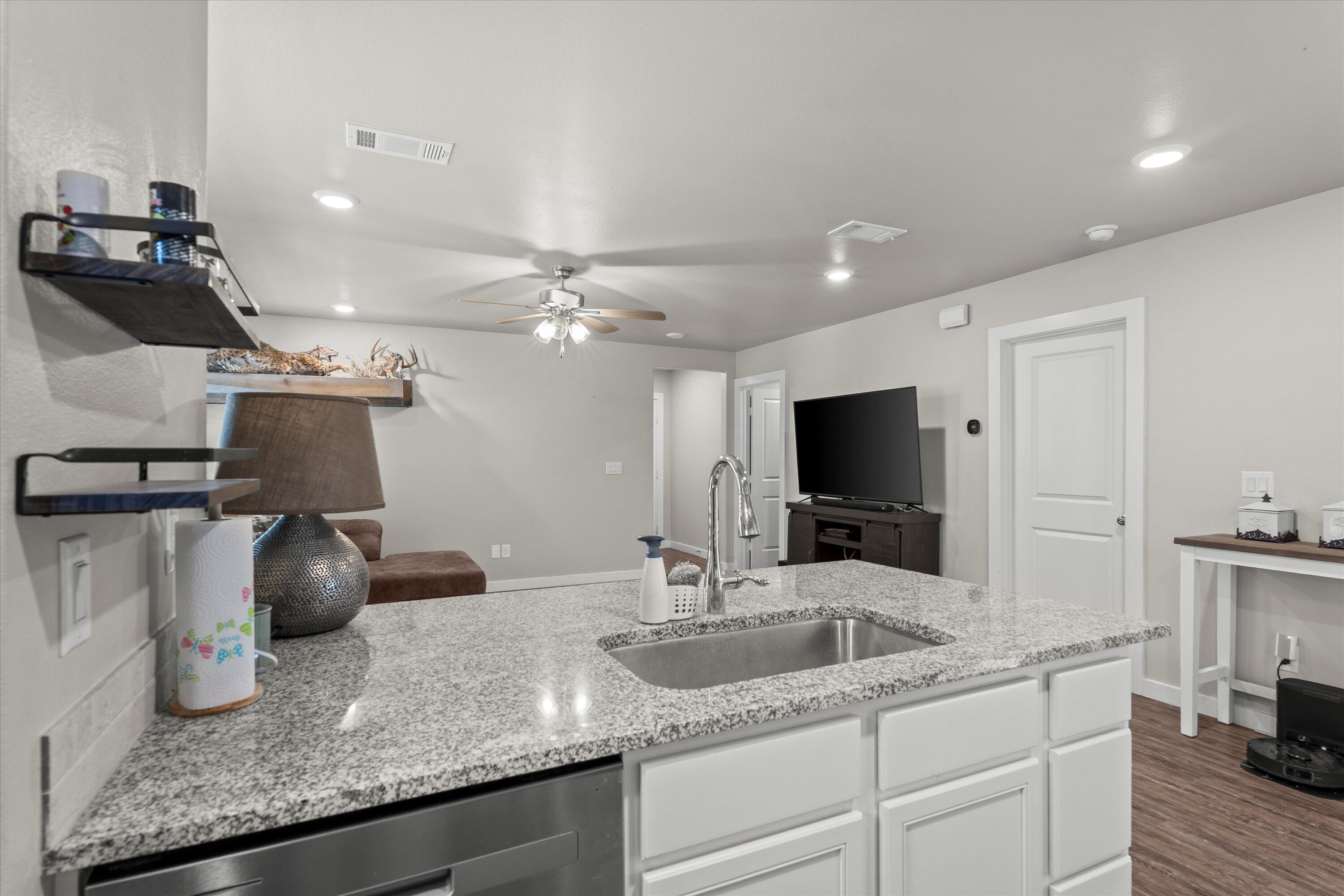 2015 134th Street Lubbock, TX 79423 - Photo 6 of 13 kitchen to living room