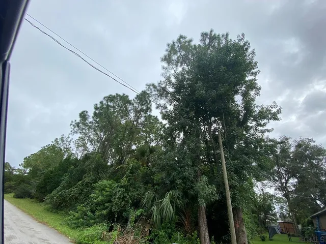 a sign broad on the side of the road