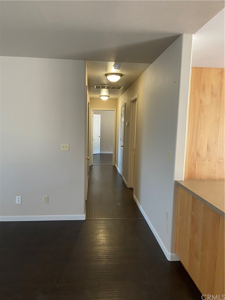 4919 Usona Road Mariposa, CA 95338 - Photo 8 of 38 Hallway leading to the three bedrooms and two bathrooms with the master bedroom door at the end of the hall.