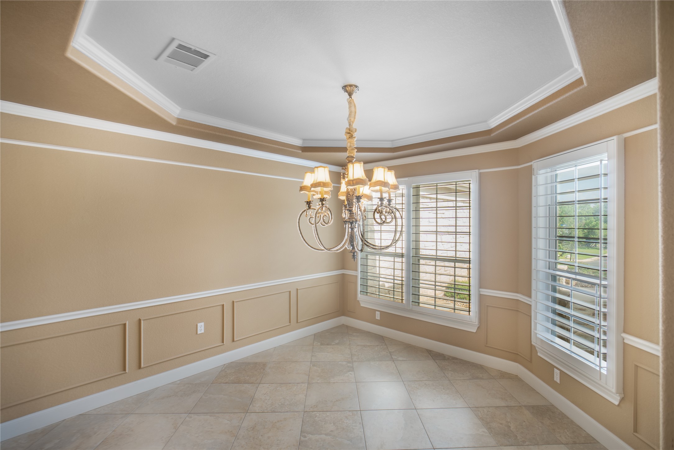 214 Summit Street Georgetown, TX 78633 - Photo 19 of 38 This inviting space features elegant crown molding, decorative wainscoting, and tiled flooring
