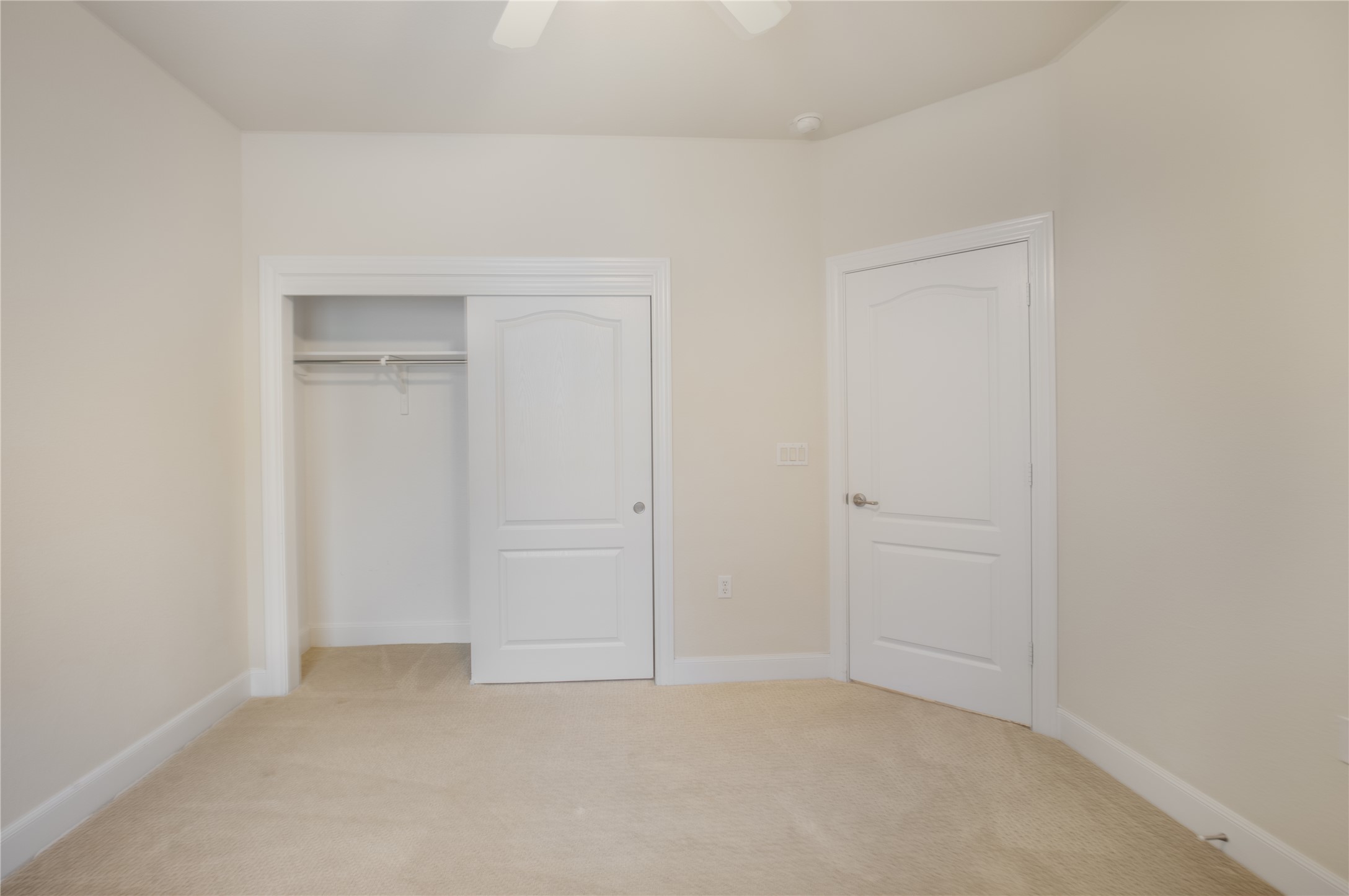 214 Summit Street Georgetown, TX 78633 - Photo 30 of 38 This room features light-colored walls, carpeting, and a closet with sliding doors