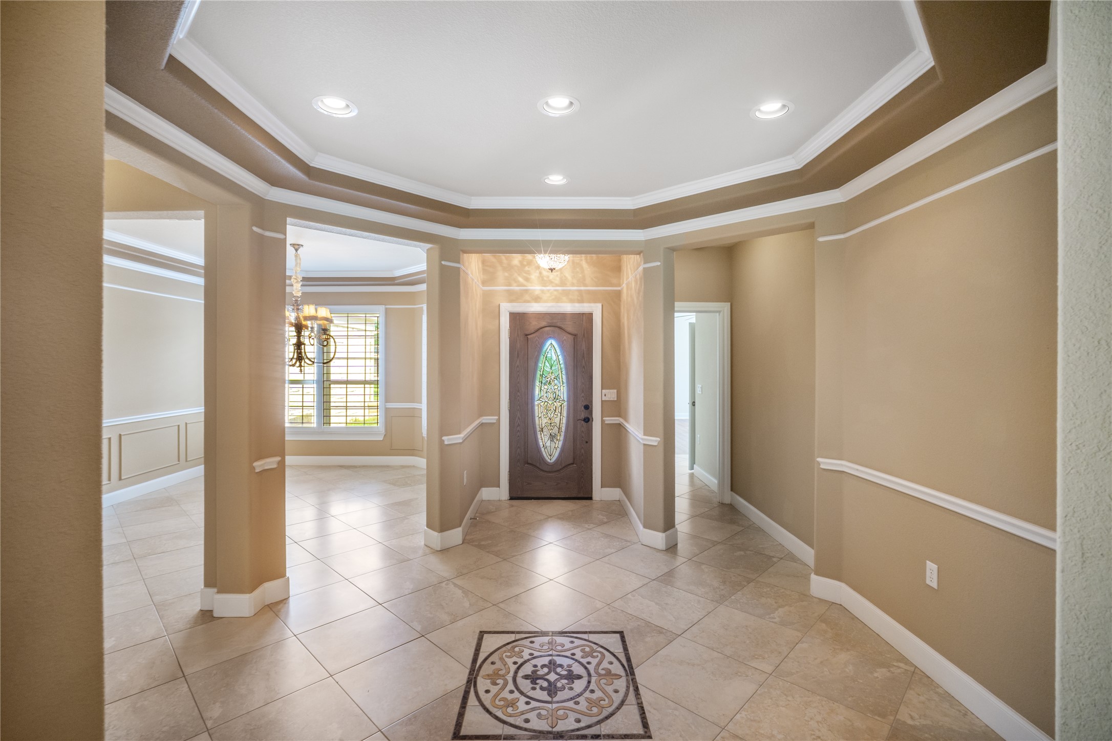 214 Summit Street Georgetown, TX 78633 - Photo 6 of 38 The property features a spacious entryway with tile flooring, accented by a decorative inlay