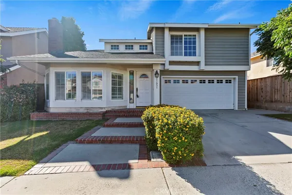 front view of a house with a garden