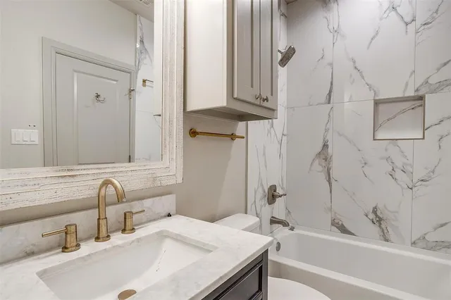 a bathroom with a bathtub and a sink