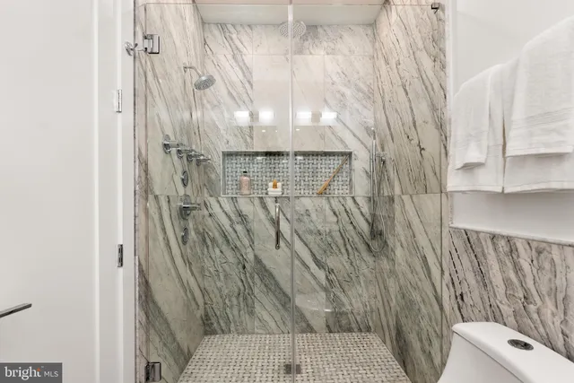 a bathroom with a shower curtain and a sink
