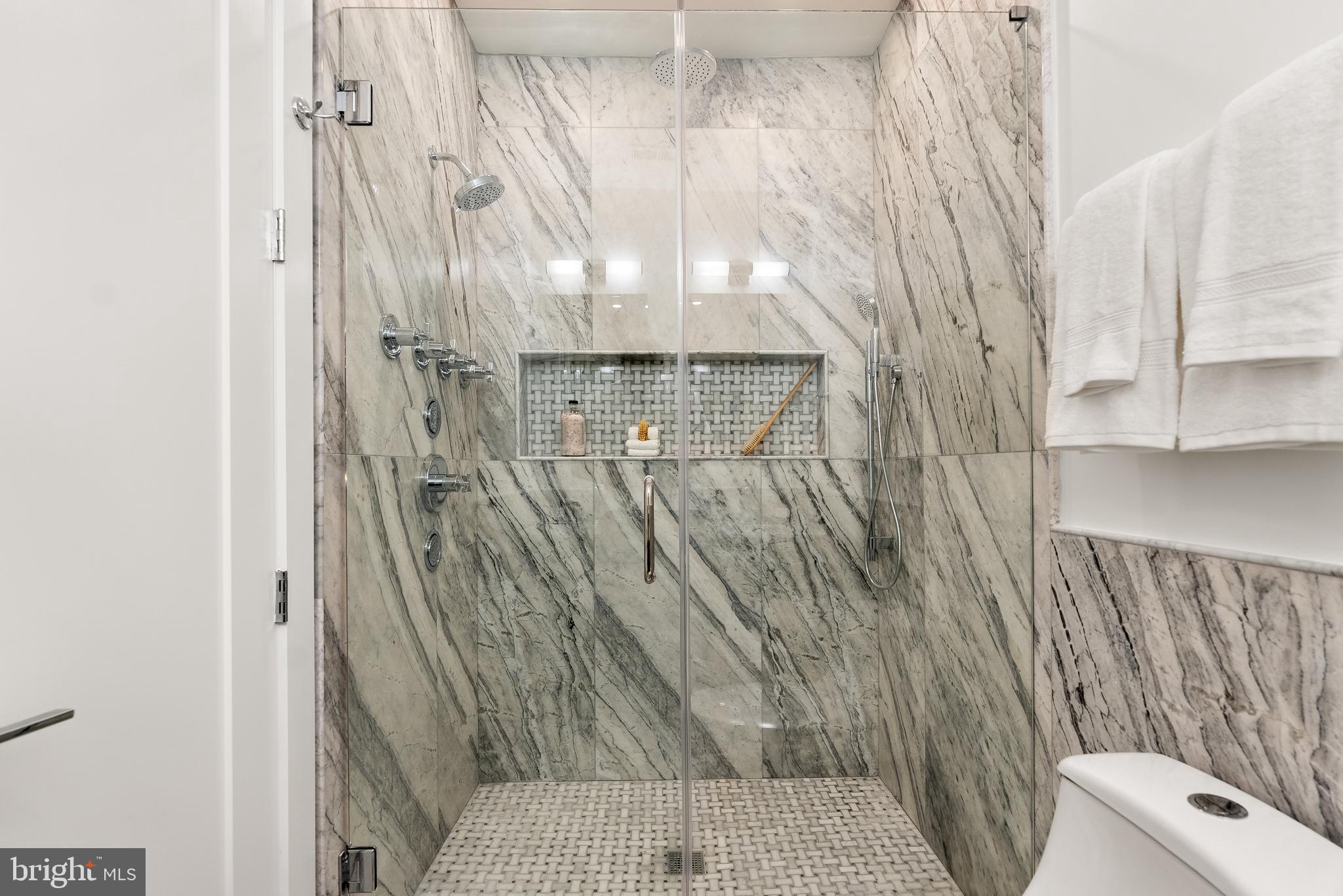 1932 11th Street Northwest Washington, DC 20001 - Photo 12 of 22 a bathroom with a shower curtain and a sink