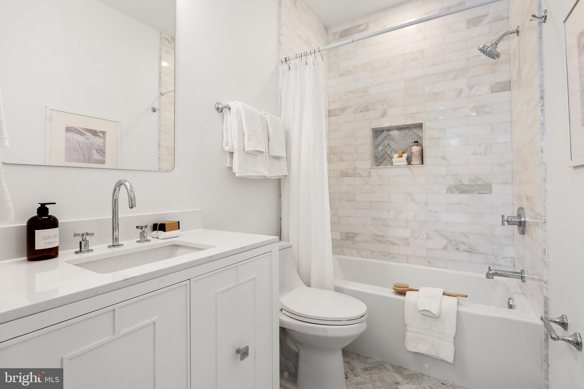 1932 11th Street Northwest Washington, DC 20001 - Photo 14 of 22 a bathroom with a sink a toilet and shower