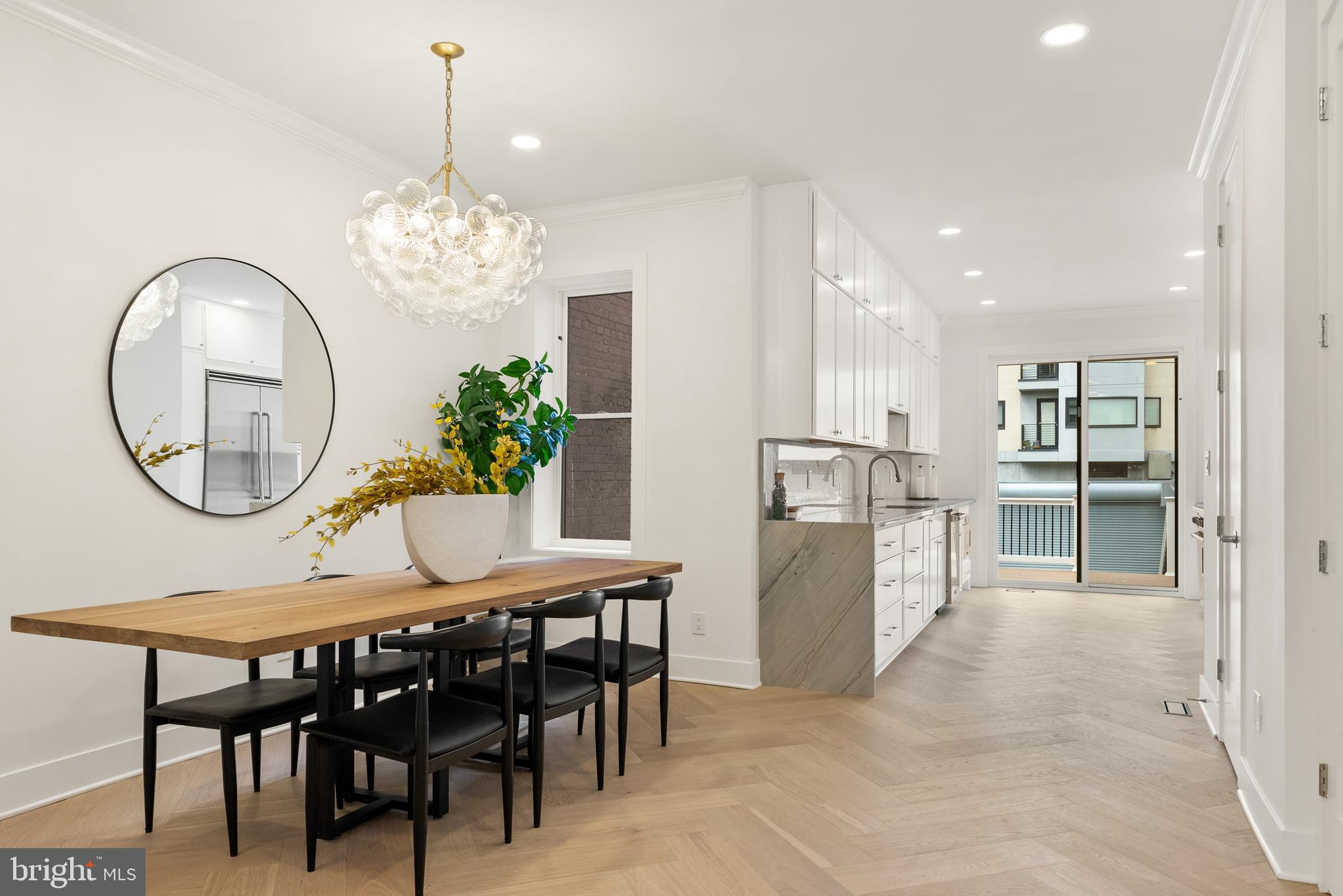 1932 11th Street Northwest Washington, DC 20001 - Photo 5 of 22 a view of a dining room with furniture and a chandelier