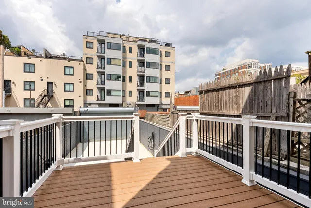 a view of balcony with wooden floor