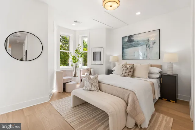 a bed room with a bed and a painting