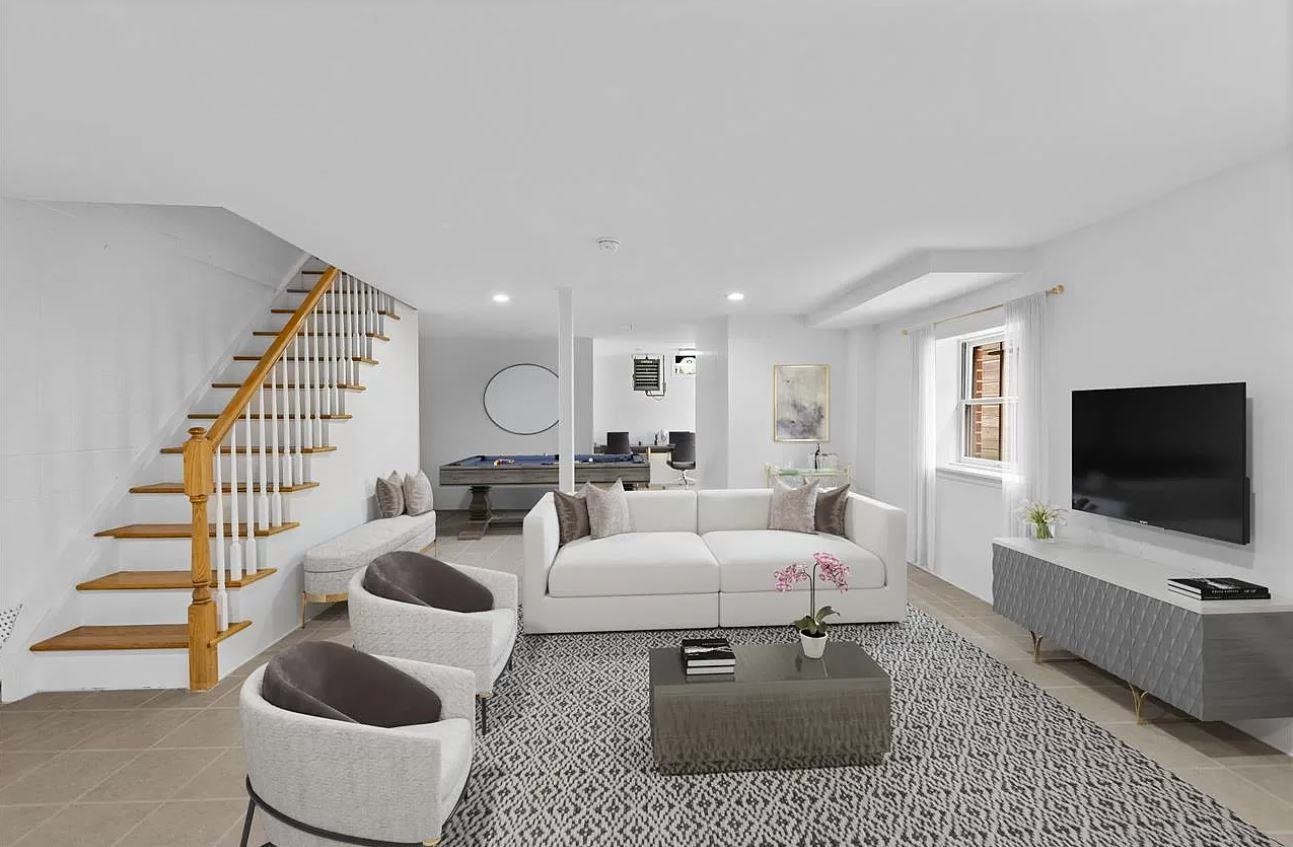 712 Hudson Street Hoboken, NJ 07030 - Photo 2 of 16 a living room with furniture and a flat screen tv