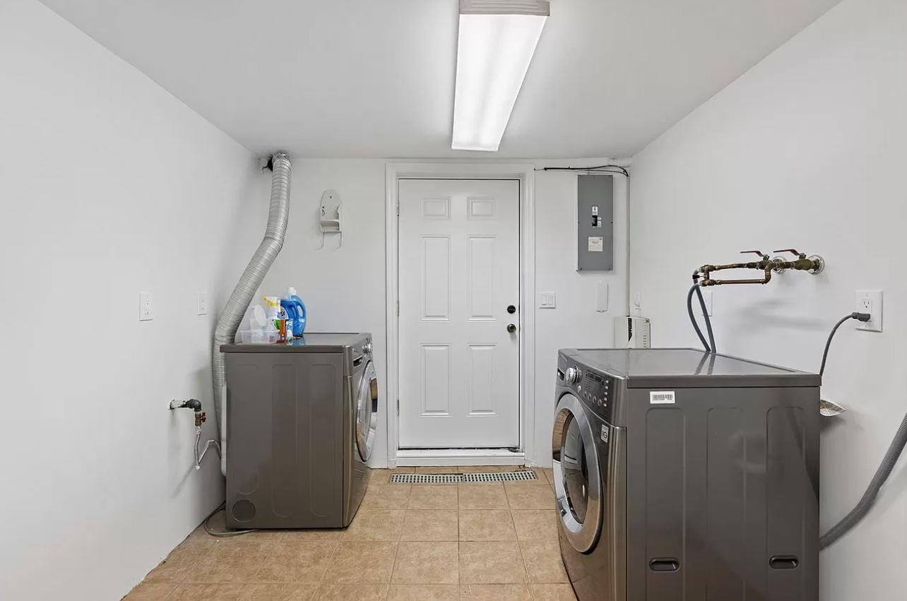 712 Hudson Street Hoboken, NJ 07030 - Photo 13 of 16 a utility room with dryer and washer