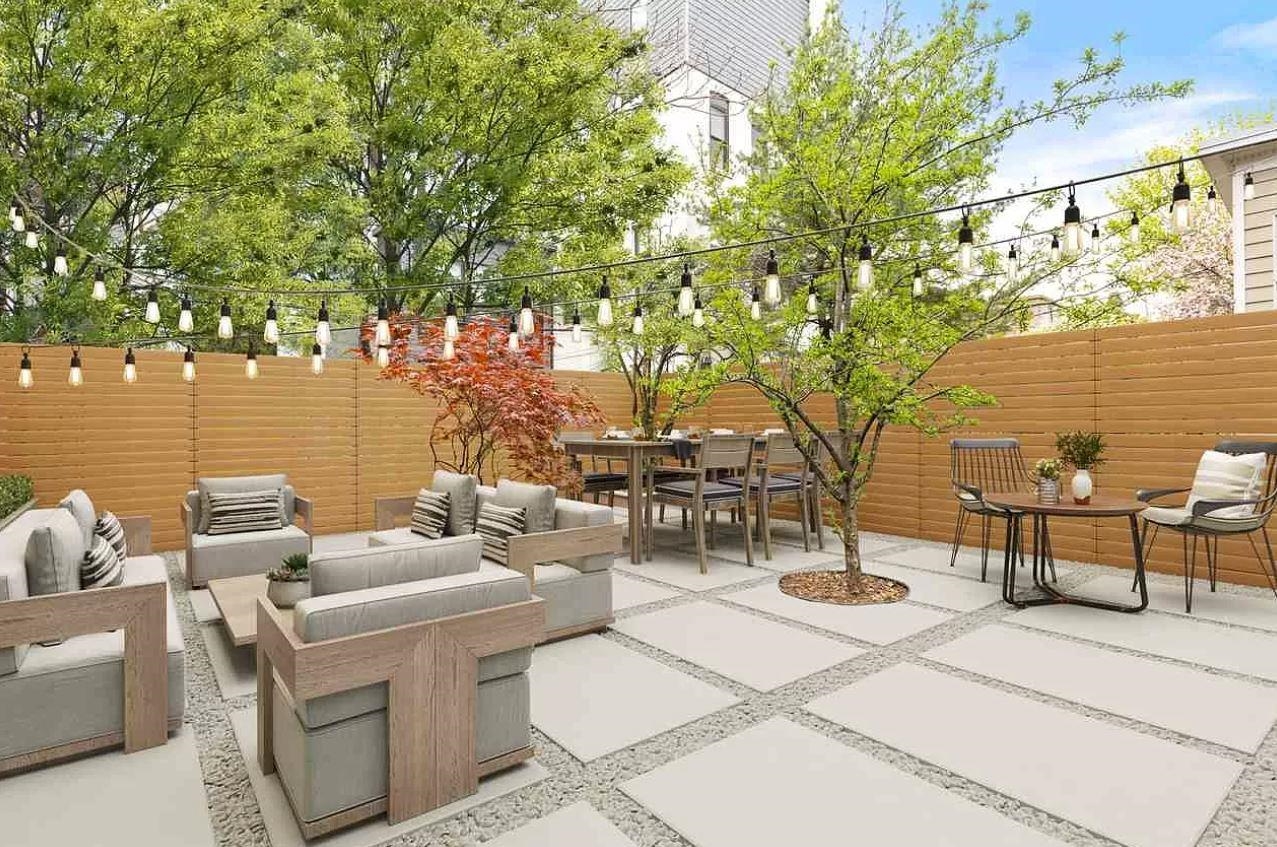 712 Hudson Street Hoboken, NJ 07030 - Photo 6 of 16 a view of a patio with couches table and chairs and potted plants