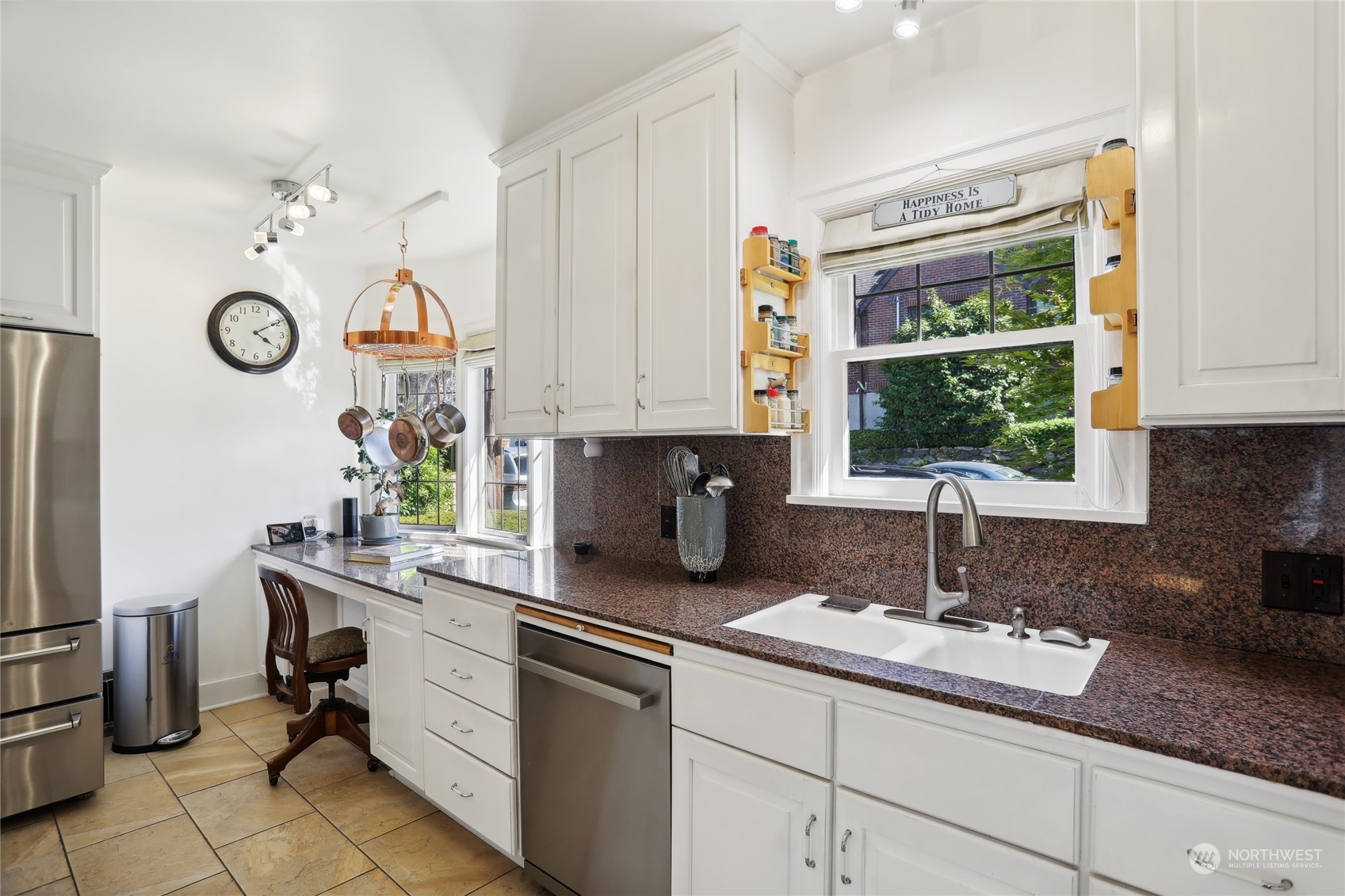 314 Halladay Street Seattle, WA 98109 - Photo 11 of 37 a kitchen with stainless steel appliances granite countertop a sink and a window