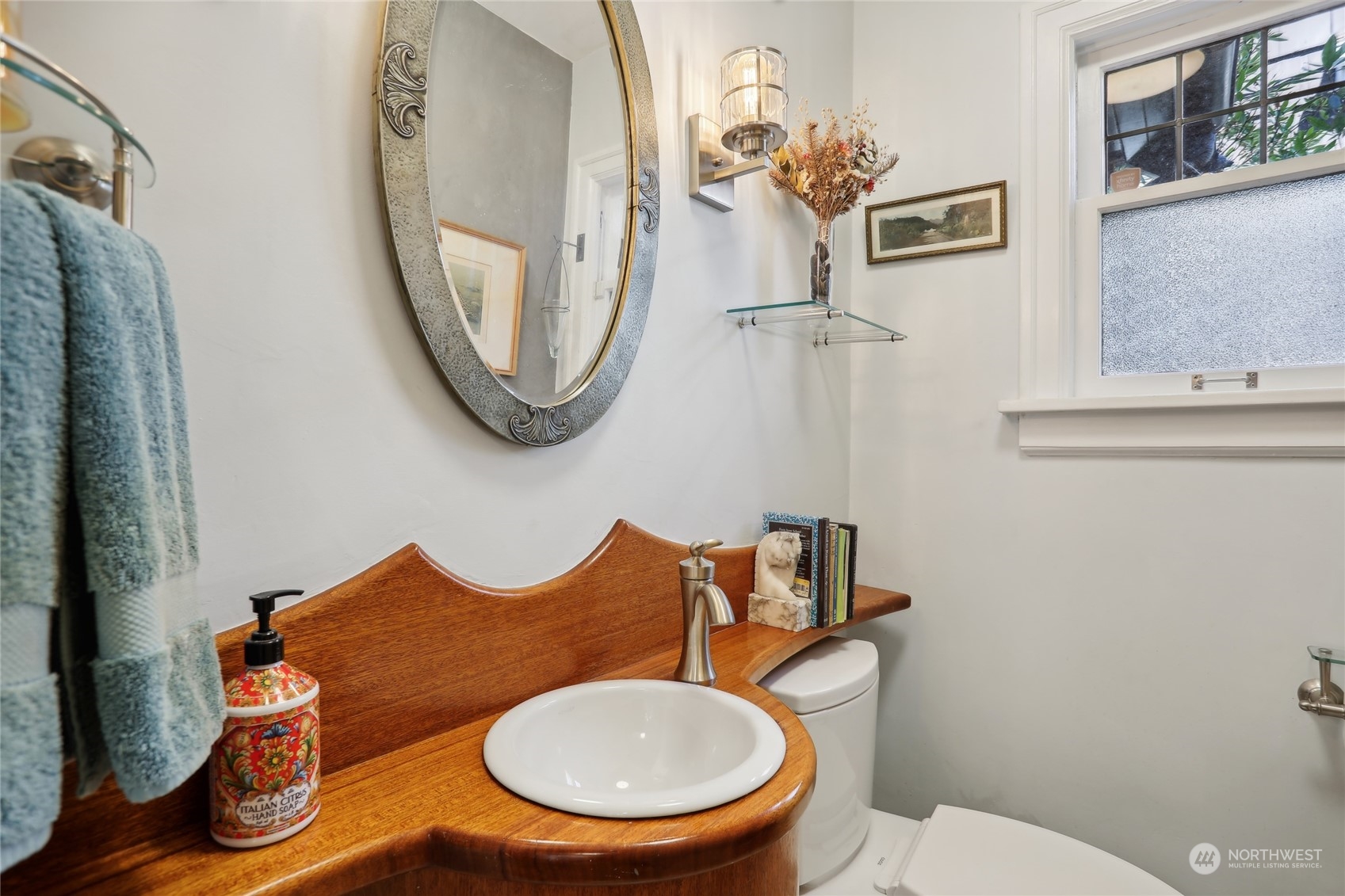314 Halladay Street Seattle, WA 98109 - Photo 13 of 37 a bathroom with a toilet mirror and vanity