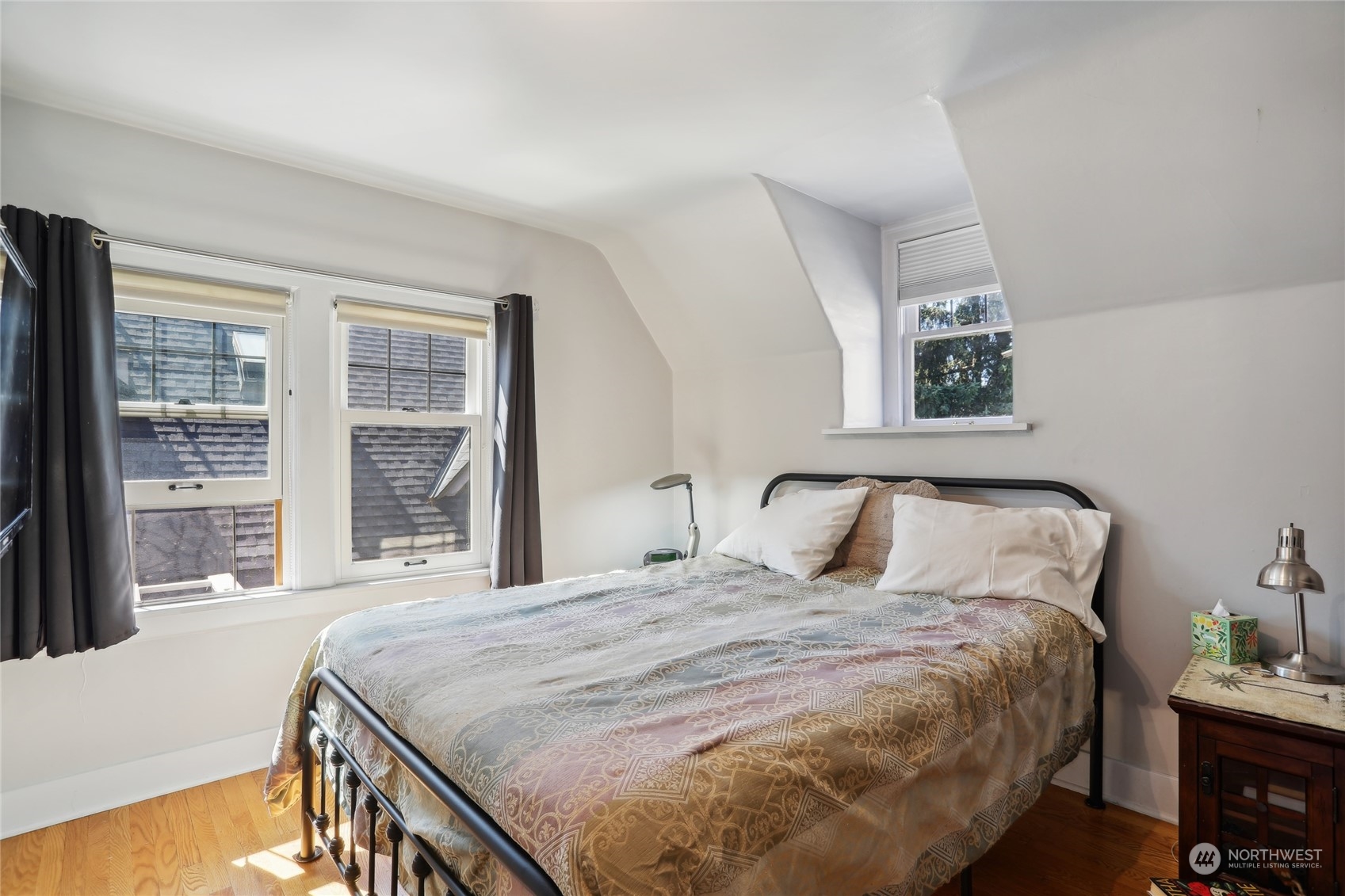 314 Halladay Street Seattle, WA 98109 - Photo 14 of 37 a bedroom with a bed and a large window