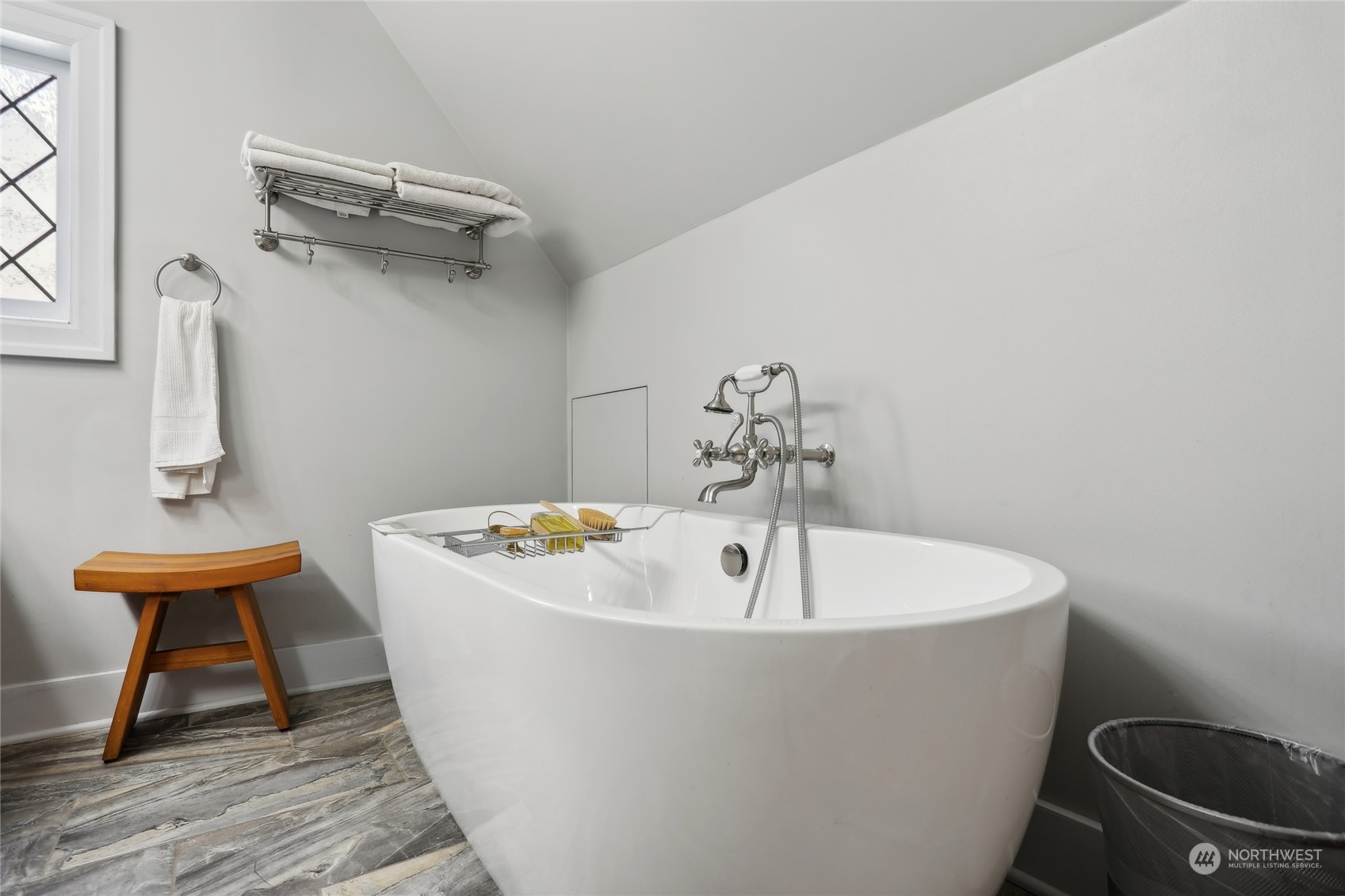 314 Halladay Street Seattle, WA 98109 - Photo 16 of 37 a white bath tub sitting next to a white sink and wooden floor