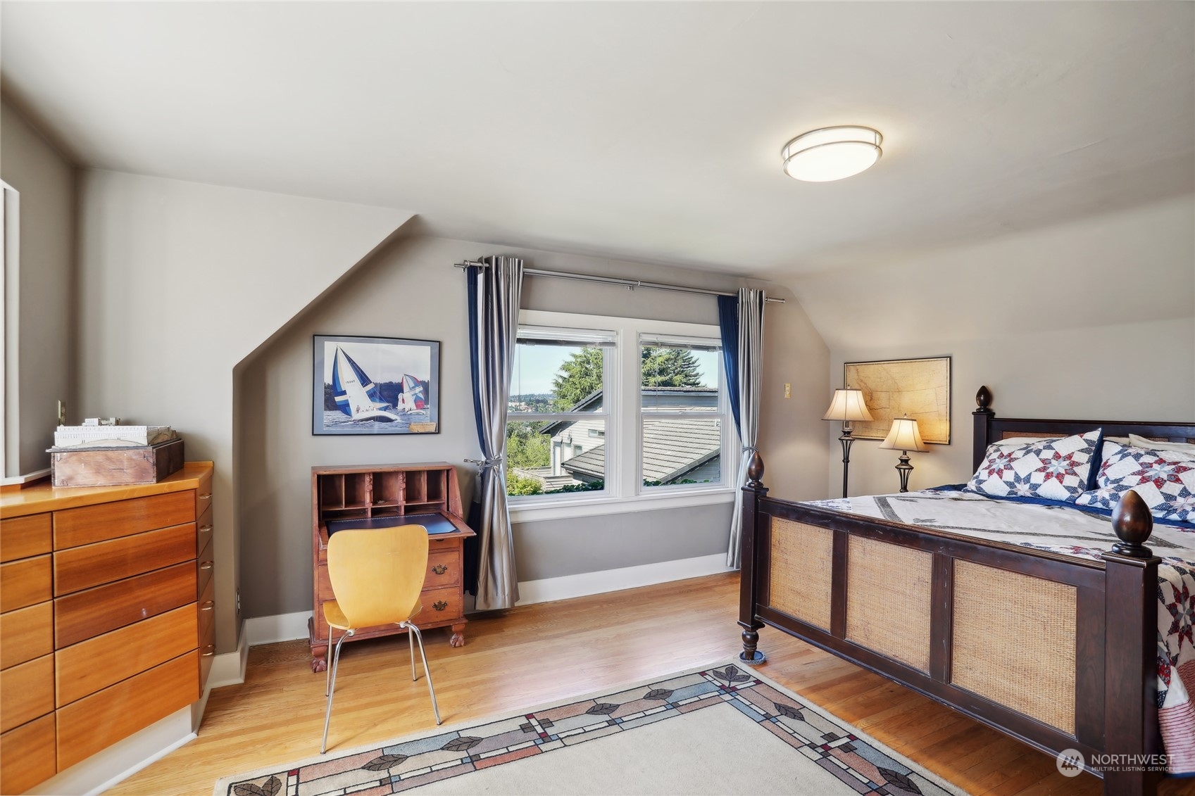 314 Halladay Street Seattle, WA 98109 - Photo 20 of 37 a living room with furniture a window and a flat screen tv