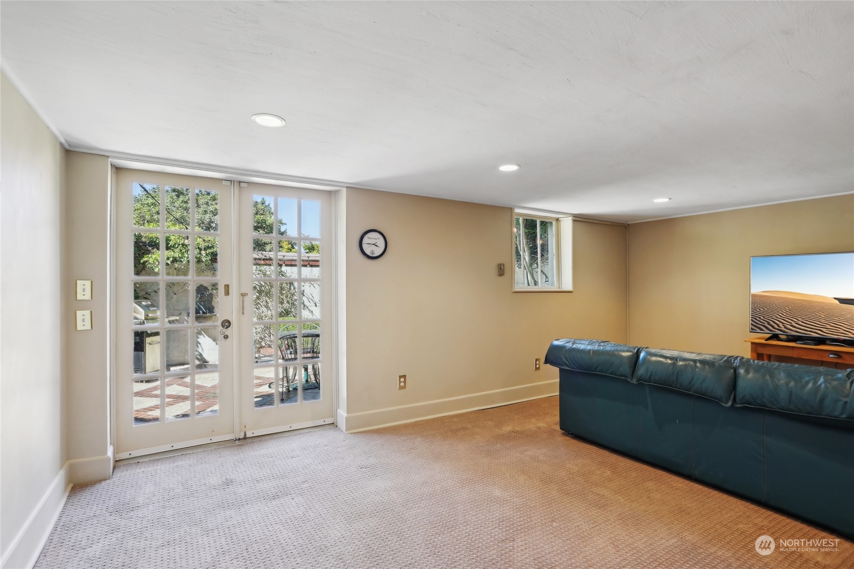 314 Halladay Street Seattle, WA 98109 - Photo 23 of 37 a living room with furniture and a flat screen tv