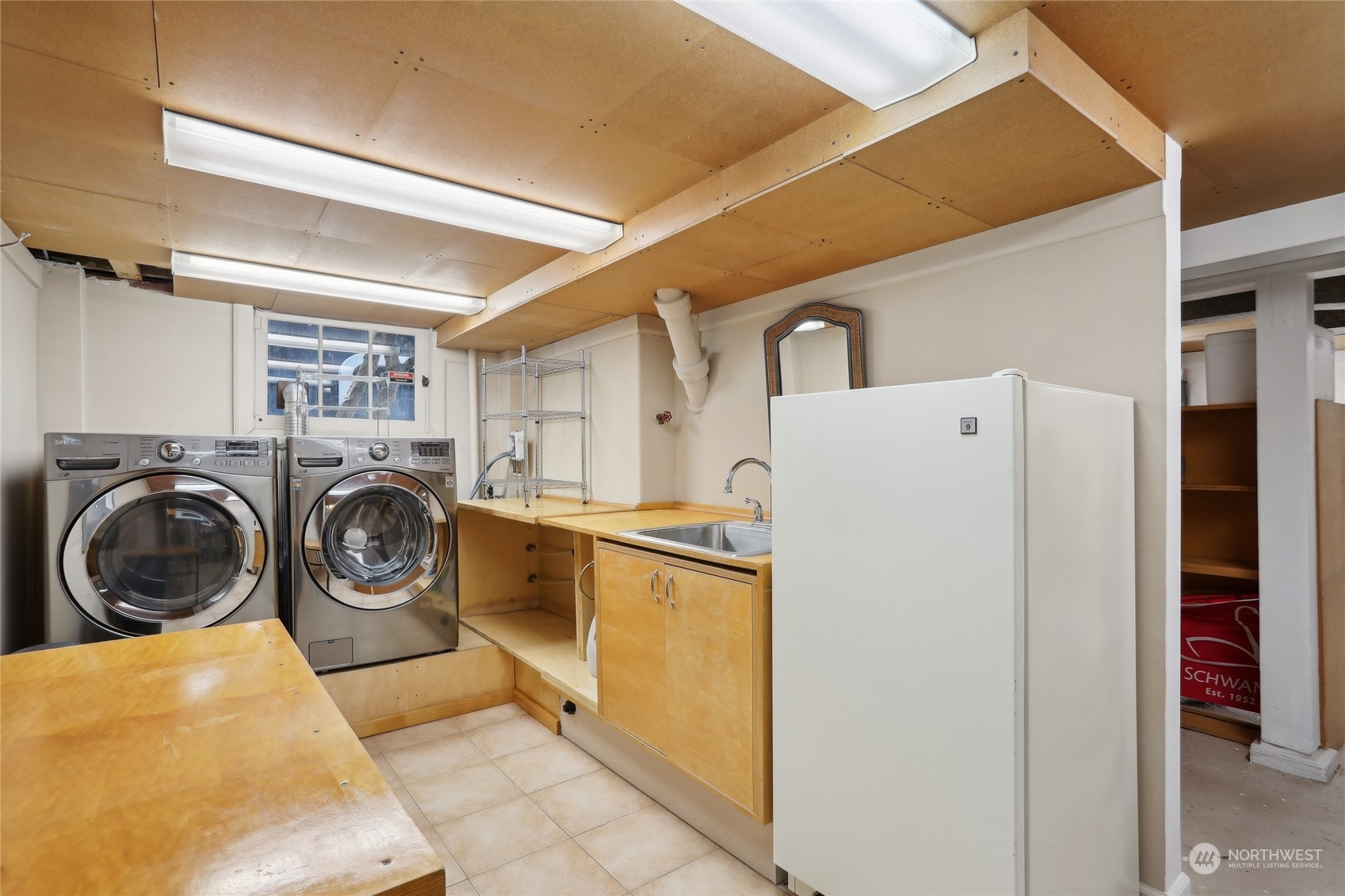 314 Halladay Street Seattle, WA 98109 - Photo 24 of 37 a utility room with dryer and washer