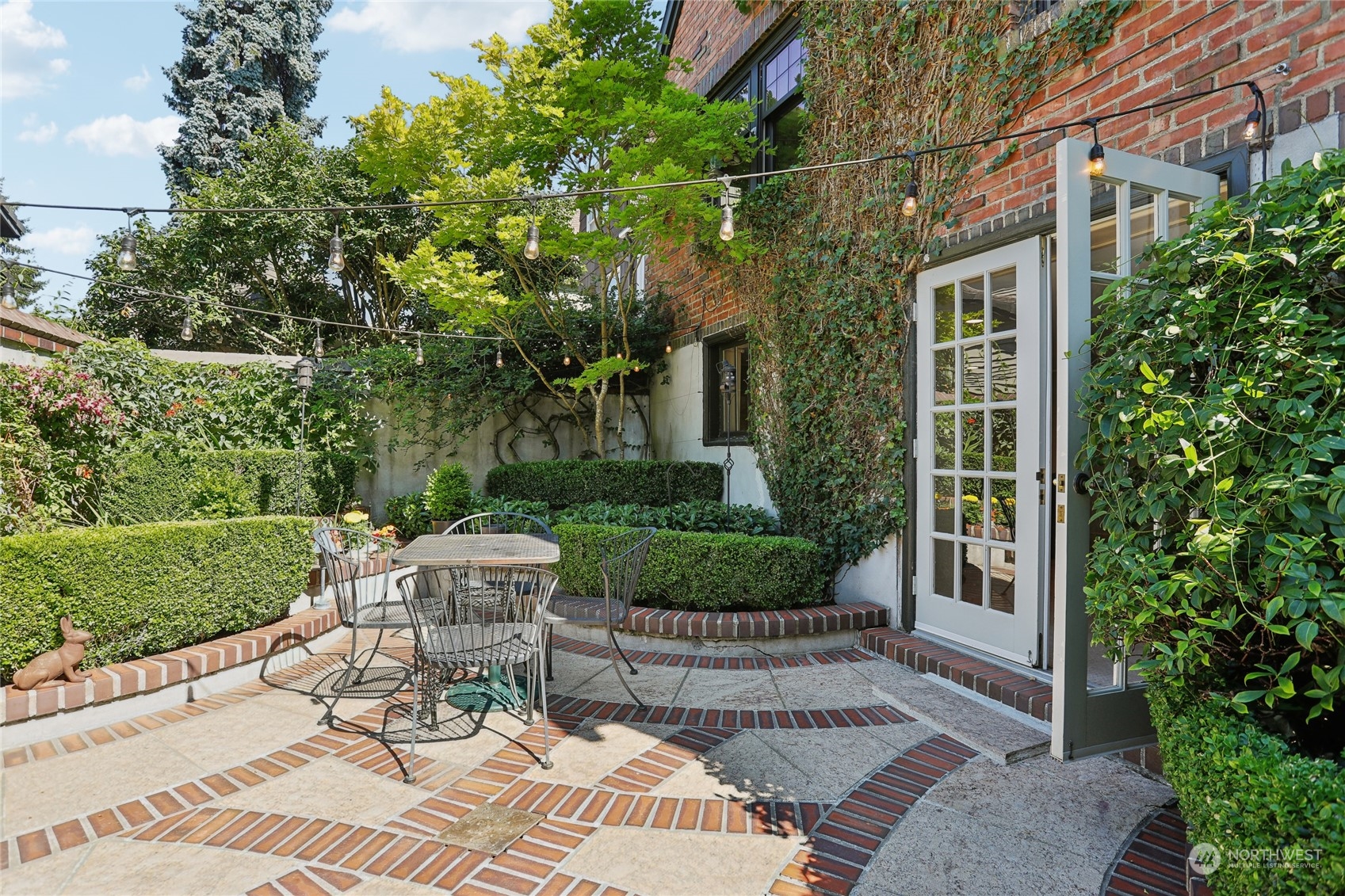 314 Halladay Street Seattle, WA 98109 - Photo 26 of 37 a view of a chair and table in backyard of the house