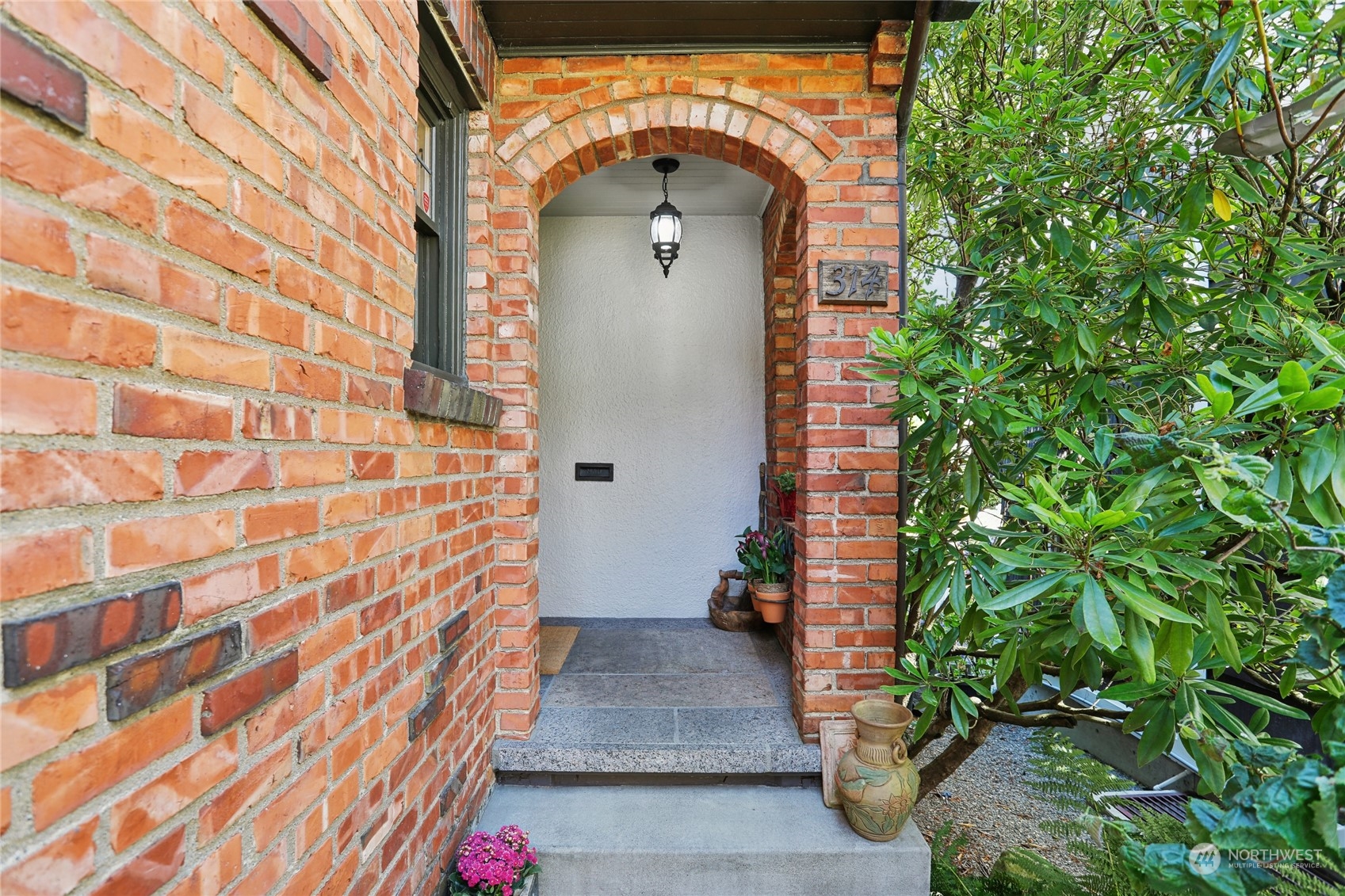 314 Halladay Street Seattle, WA 98109 - Photo 3 of 37 a front view of a house with a garden