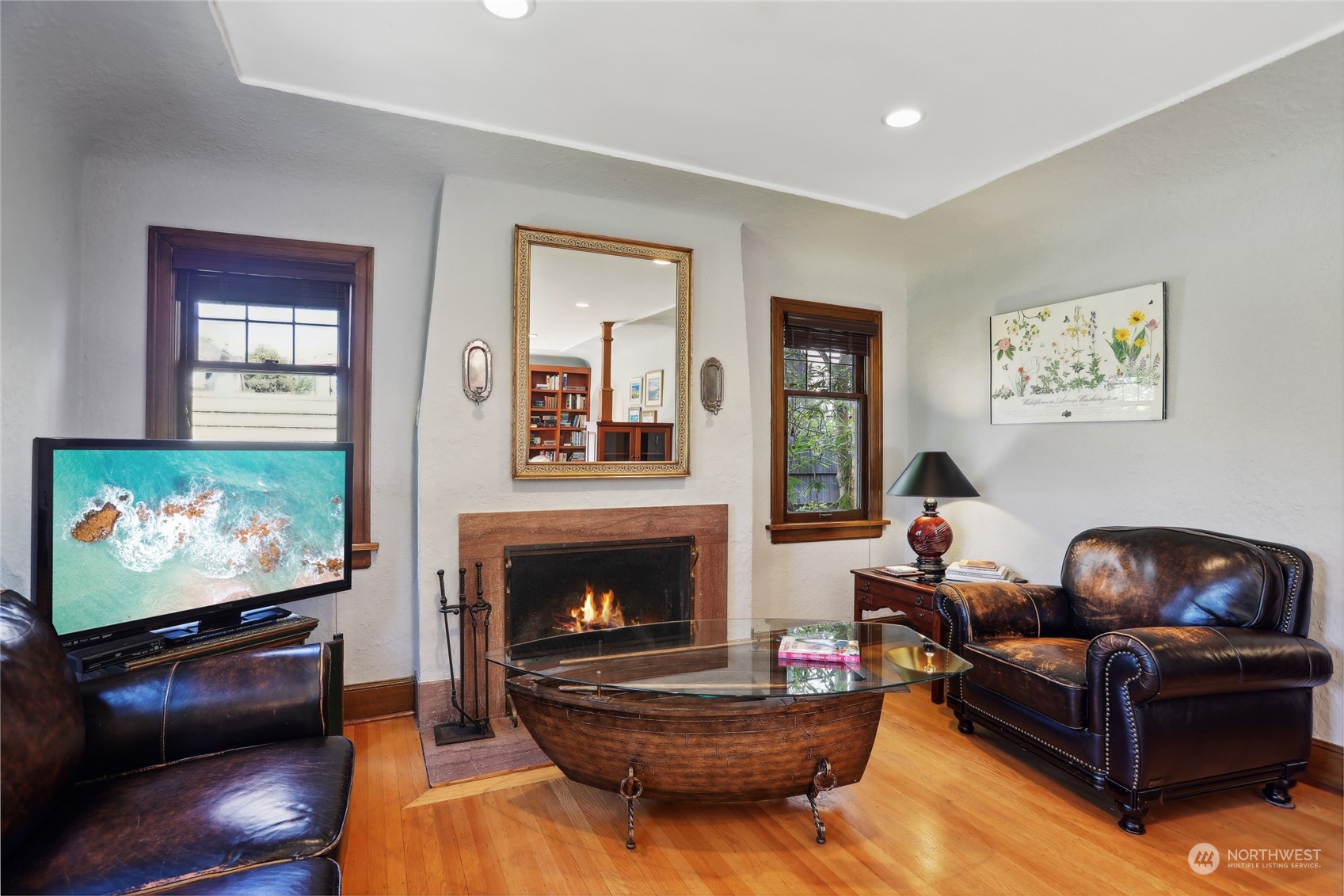 314 Halladay Street Seattle, WA 98109 - Photo 4 of 37 a living room with furniture a flat screen tv and a fireplace