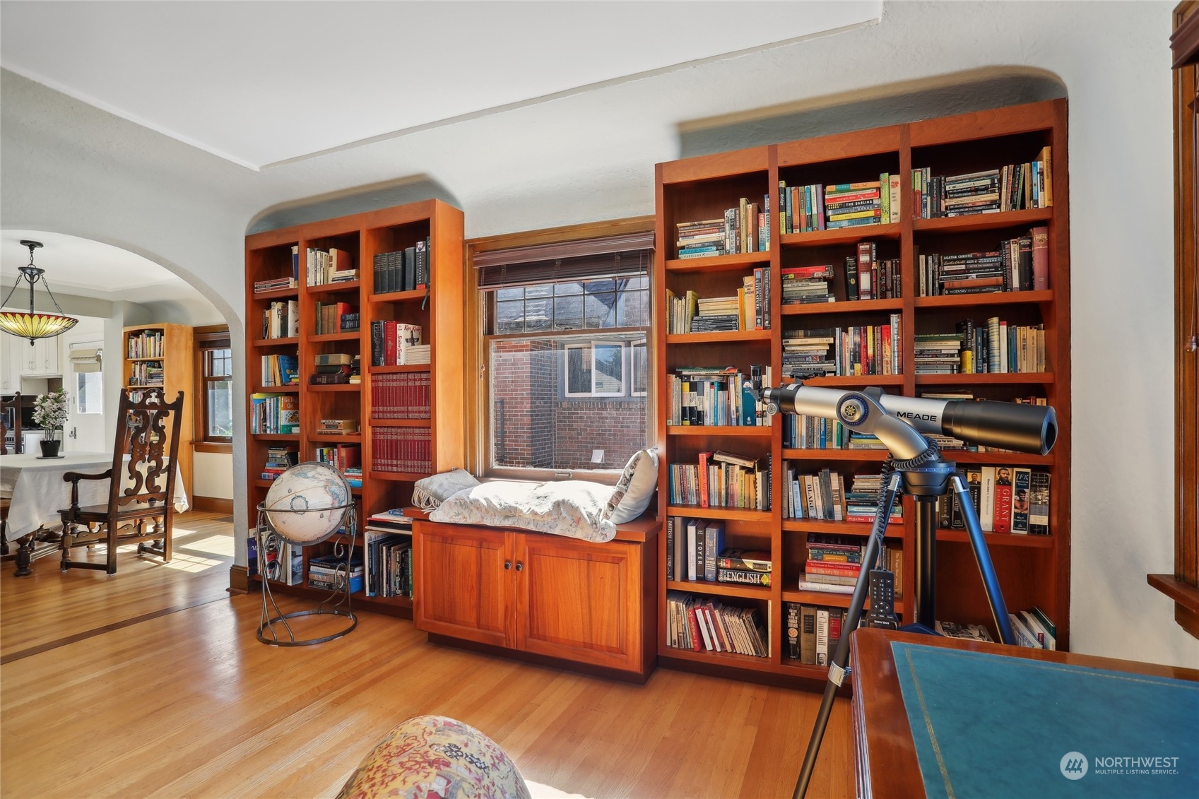 314 Halladay Street Seattle, WA 98109 - Photo 7 of 37 a workspace with furniture book shelf and wooden floor